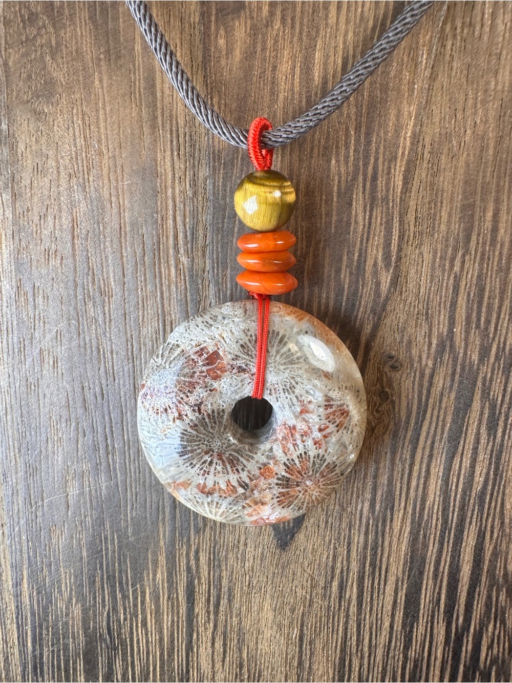 Handcrafted Red and Brown Coral Fossil Donut Pendant Necklace on Brown Rope - Picture 14 of 16